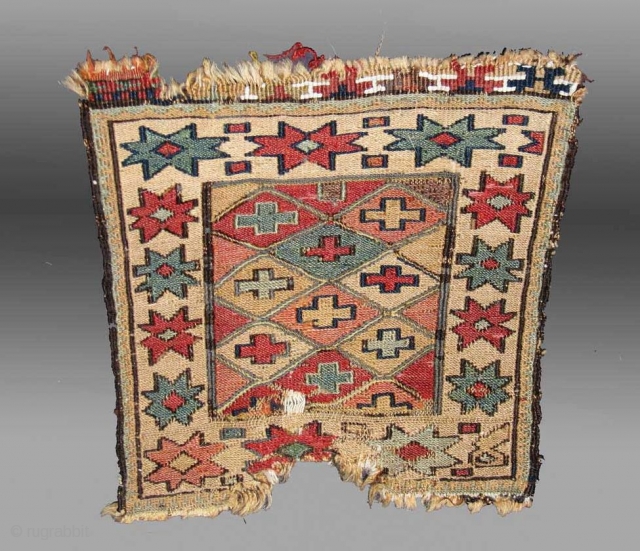 Here is a very old and beautiful small Shahsavan soumak bagface, roughly 28x28cm

There is obvious damage but the almost pastel colours are sublime and have mellowed beautifully.

Note the bleached white cotton (wool?)  ...