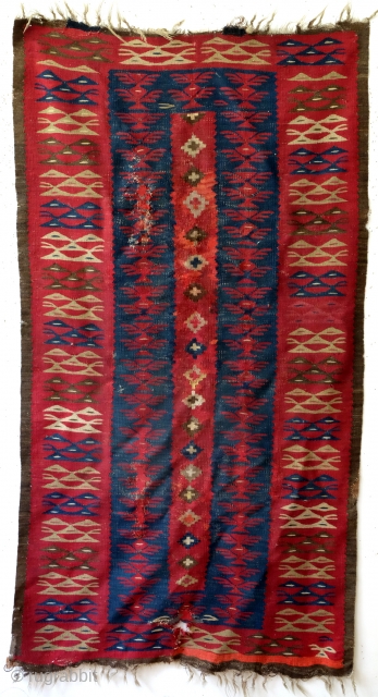 Rare and fine 1850 - 1870 Bulgarian kilim. 
it has an old band sewn on with brass rings.
Always was a wall hanging - it preserved this kilim. 
'as is". 
94 x 180  ...