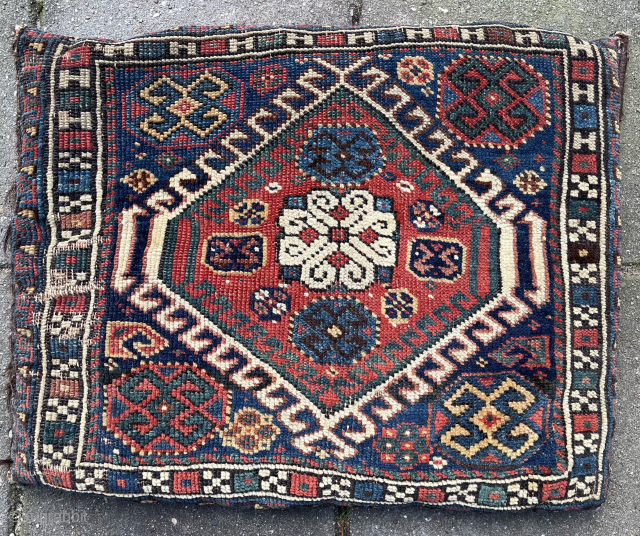 Antique Qashqai Bag + its original kilim backside, made in to a pillow. Low pile and one area with wear ( detail pict.). Last picture in full sunshine. robvanwieringen@telfort.nl    