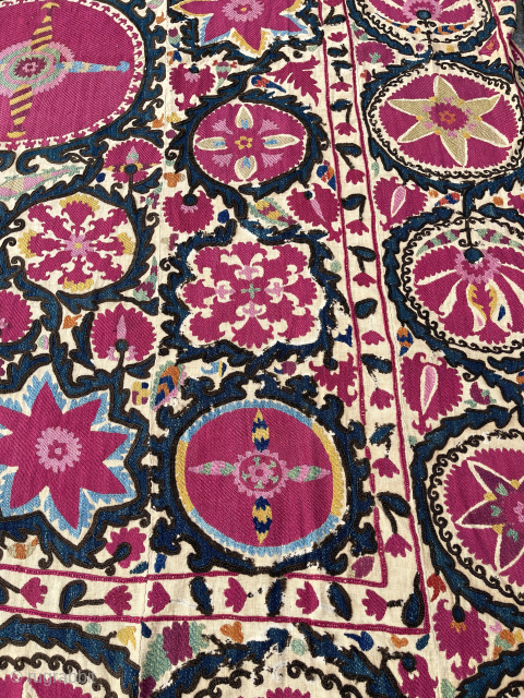 Lovely Suzani, Khujand, North-Tajikistan, 244 x 174 cm., mid 19th c. Silk embroidery on handspun cotton (6 panels) with all natural dyes (11), with cochineal being the dominant colour.
Some smaller damages: all  ...