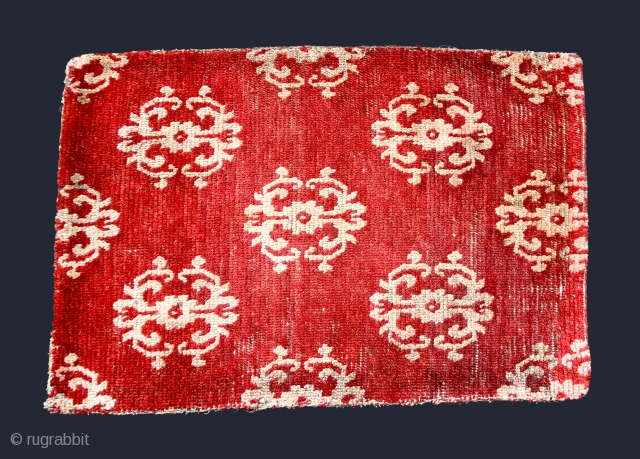 Tibetan Carpet (TC13)
Wine colored fragment with stylized dorje design.
Well used but solid condition.
31 1/2”  x  21 1/2”
POR              