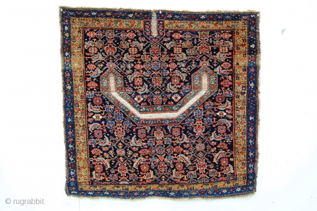 3' x 3'7" West Persian saddle rug. The design is Shene, but the back is a sort of Arak village weave. Good color, decent condition, all natural dyes.     