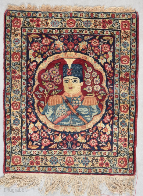 This late 19th century Laver Kerman portrait rug of the Shah of Iran #8081 measures 1’10” X 2’3”. It has a circular framed image of one of the Shahs of Iran surrounded  ...