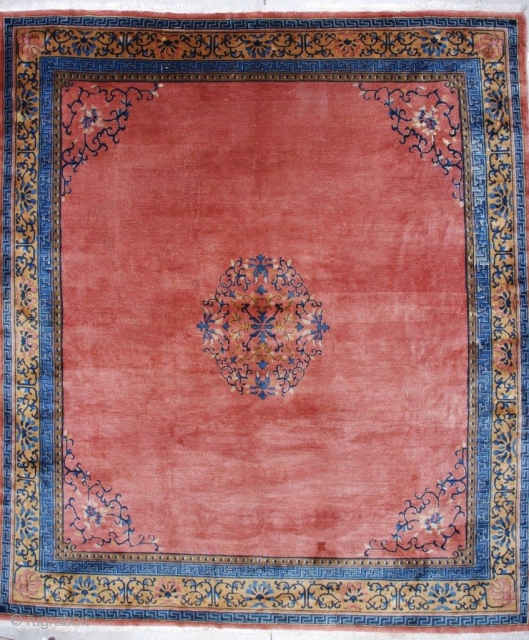 #7162 Antique Peking Chinese Rug This circa 1910 Peking Chinese rug measures 11’1” x 12’9”. It has a medallion in a circle with vines in blue, ivory, and pale brown to gold.  ...