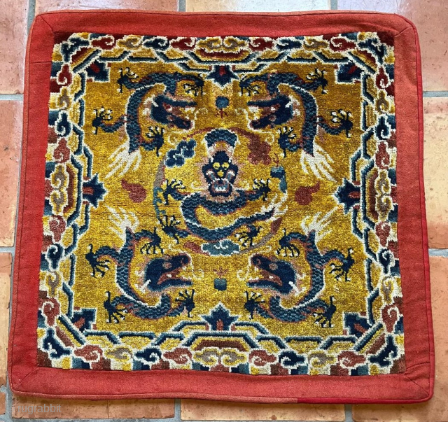 This last quarter 19th century Peking Chinese Chair Seat Oriental Rug #8217 measures 2‘6“ by 2‘5“. It has a yellow ground with a blue dragon in each corner surrounding a full frontal  ...