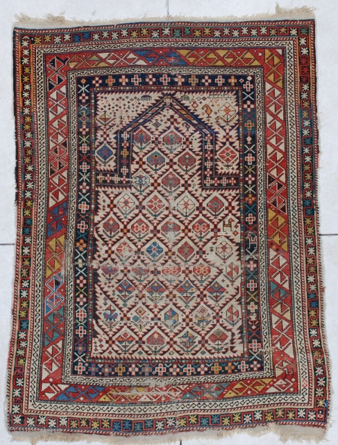 #6611 Shirvan Antique Caucasian Rug 3’6″ X 4’10”
This antique Shirvan Oriental area rug dated 1818 measures 3’6” X 4’10”. It is an extremely early dated Shirvan prayer rug. It has an ivory  ...