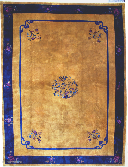 Oversized! This circa 1910 Mandarin Chinese Oriental rug #6981 measures 11’0” X 14’6”. It has a wonderful yellow gold field with a medallion of a rockery with a flowering tree in purple,  ...