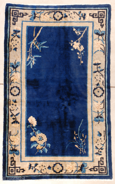 This Peking Chinese rug #7621 measures 2’11’ x 4’9” (90 x 149 cm). It has a deep indigo field with flowering bamboo in opposite corners and chrysanthemums in the other two corners  ...