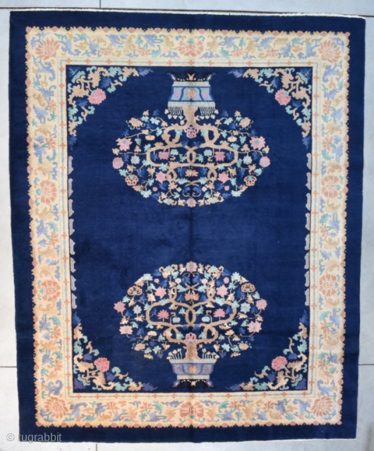 This circa 1920 Peking Chinese Oriental handmade wool rug #8154 in an Art Deco style design measures 8’0” X 9’10”. It has a midnight blue ground containing a motif of two potted  ...