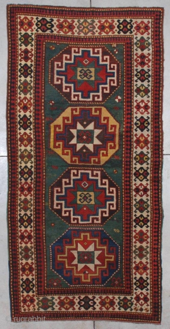 #7198 Kazak Antique Caucasian Rug
This third-quarter 19th-century Kazak measures 4’2” X 8’5” (128 x 259cm). It has four memling gul medallions, one on a blue ground, one on an aubergine ground, one  ...