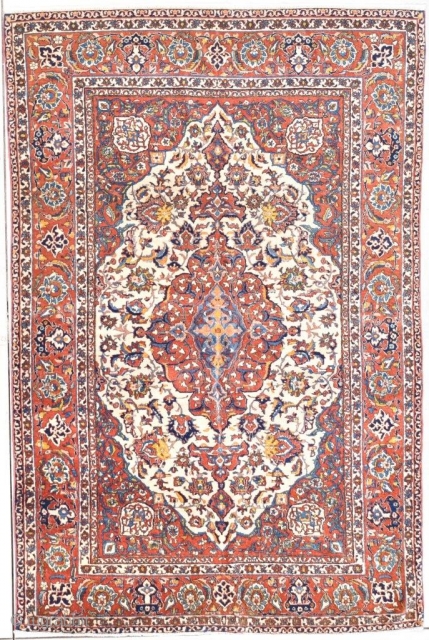 This 1st quarter 20th century antique Isfahan Persian Oriental rug #7751/7752 measures 4’9 “ x 7’3”. It is one of a matching pair of rugs. It has an ivory floral medallion with  ...