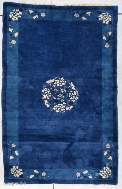 This circa 1890 Peking Chinese rug #8010 measures 5’1” X 7’9”. It is in mint condition with a beautiful indigo ground which has a center medallion of a wreath made up of  ...