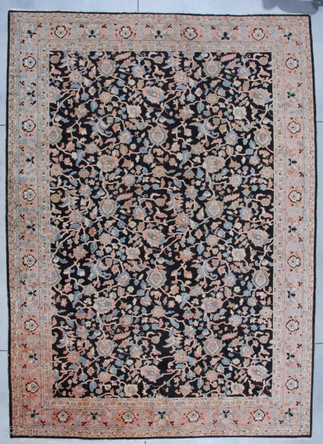 #7116 Antique Agra Rug from India
This Agra measures 11’1” x 15’3”. It has a black background with a vine and tendril design in   coral, very pale sky blue, ivory and  ...