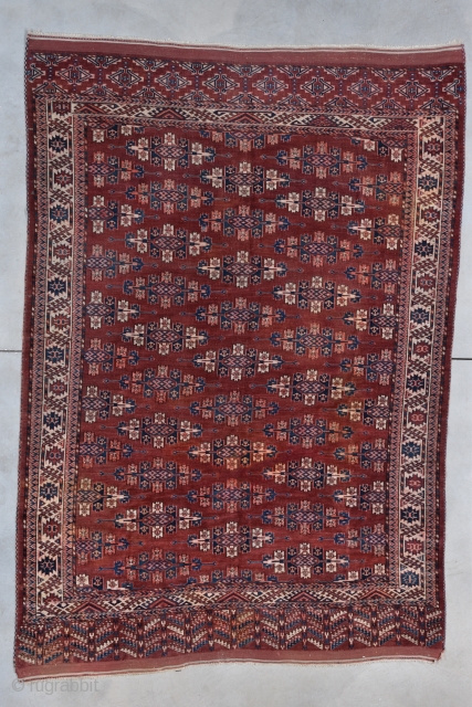 Antique Yomud Oriental Rug  #7844
This late third quarter 19th century Yomud measures 6’6” X 9’6”. It has a deep red field covered in Kepse guls in ivory, blue, apricot and lots  ...