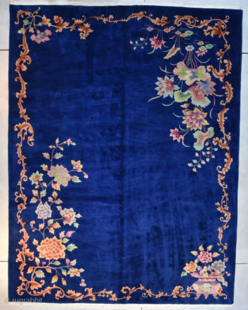 This circa 1925 Art Deco Chinese handmade wool Oriental Rug #8153 measures 8’7 x 11’6”. It has a beautiful royal blue ground with designs in the four corners. Every one of them  ...