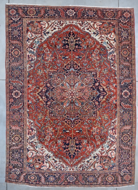 #7695 Heriz Oriental Rug

This circa 1930 Heriz handmade Oriental Rug measures 9’6” X 13’3” (292 x 401 cm). It has a tomato red field with an overall combination geometric and floral motif  ...