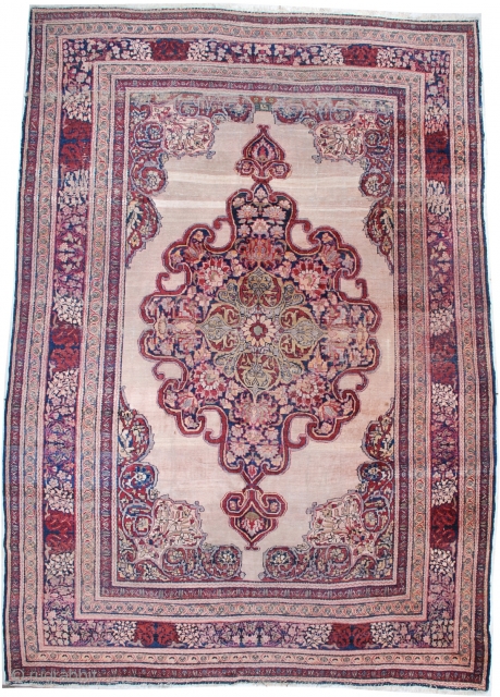 # 7072 Antique Kermanshah

This circa 1880 antique Kermanshah Persian Oriental Carpet measures 9’2″ x 12’10”. It has a beautifully drawn large pulled medallion in pale green, cherry and navy blue on an  ...