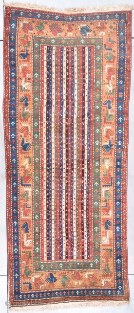 Antique Kazak Rug  #7862 This circa 1880 Kazak Oriental rug measures 4’2” X 10’6”.  The field design is the so called Cane design consisting of stripes with a meandering ‘S’  ...