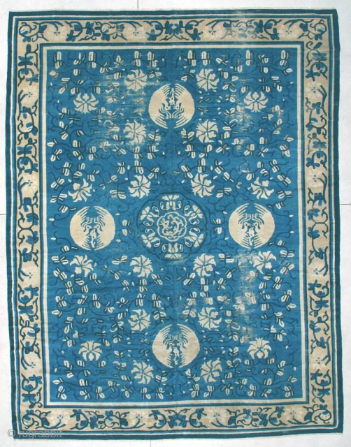 #6232 Very Antique Peking Chinese
This circa 1850 very Antique Peking Chinese rug measures 8’10” x 11’5”. It has a dark blue to indigo vine design with ivory flowers completely covering the light  ...