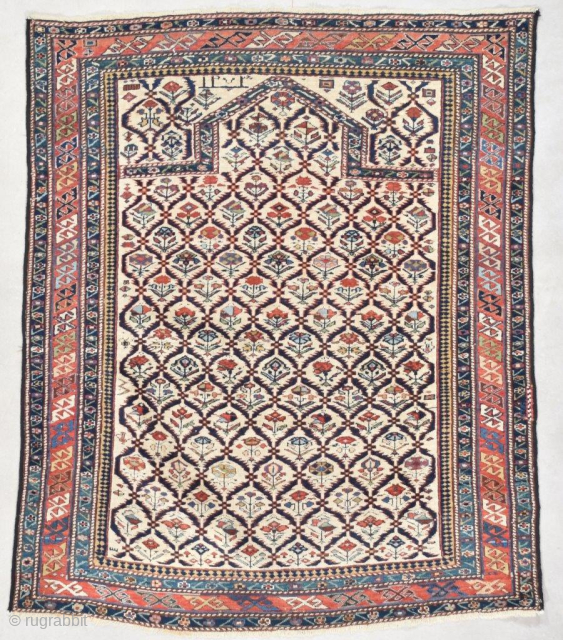 This dated 1852 Marasali Shirvan antique Oriental Rug #7559 measures 3’7” X 4’4” (112 x 134 cm). It has a lattice design on an ivory ground. Each lattice opening contains a flower.  ...