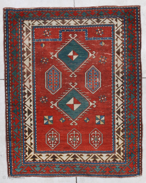 This first half 19th century Borchalo Kazak #6876 measures 3’10” X 4’9”. It is a lovely little prayer rug which has a tomato red field and a very simple prayer design.   ...