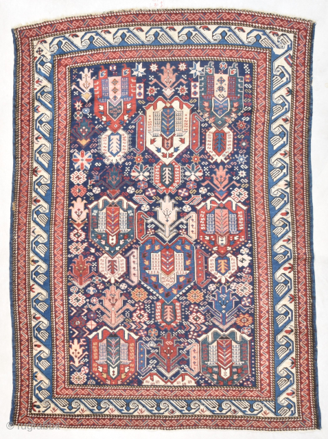 This very antique Kuba rug #7735 measures 4’3” X 5’11” ( 131x 182 cm). As far as the putting an age on this rug, this could possibly be an 18th century rug.  ...