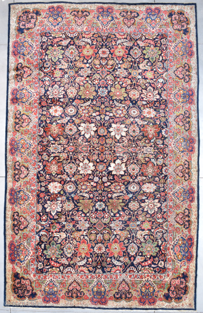 This Palace sized 1st half 20th century Mahal Persian Oriental rug measures 10’9” X 17’4” (332 x 530 cm). It has a beautifully drawn overall floral motif completely covering the blue ground.  ...