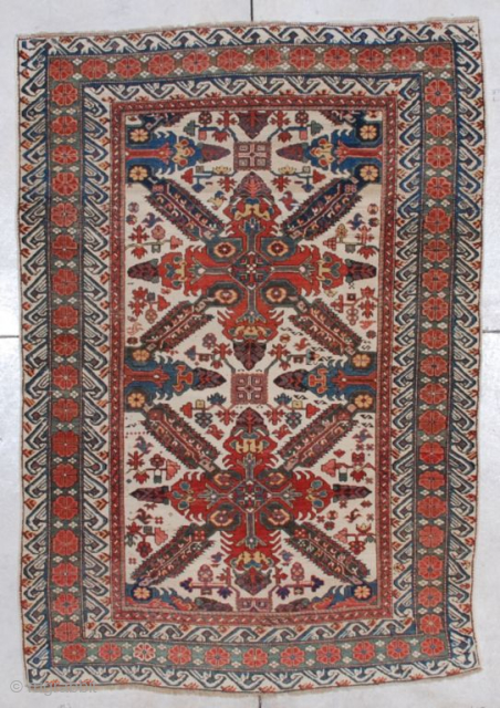 This circa 1875 Seyhore Kuba Antique Oriental Rug #5626 measures 4’5” X 6’5”. It has two complete Saint Andrews crosses on an ivory ground. It has nice asymmetrically drawn field motifs. It  ...