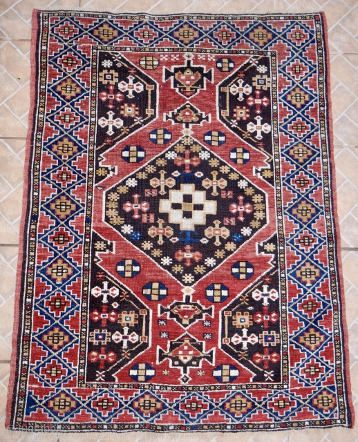 Antique Bergama rug, West Anatolia, 140 x 95 cm.  Dark brown and madder red ground with a geometrical design derived from earlier "Bellini" style Bergama area rugs. all natural dyed colours.  ...