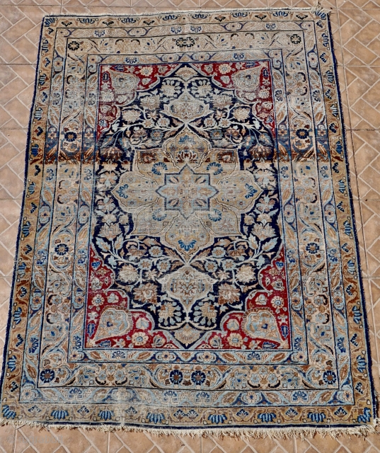 An antique Tabriz rug from the renowned Hadji Jalili workshops, 138 x 192 cm. late 19 th. century. The design with a central star-shaped medallion in ethereal blue, extending out into a  ...