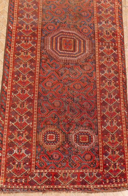 A Beshir Cloudband Main Carpet, Amu Darya region, Turkestan.  348 x 154 cm. 3rd. qtr. 19 th. century.
A few areas of wear and (corner) repair.
       