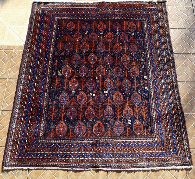 An (Aqta) Afshar rug, 190 x 160 cm. The design with a dark blue ground with 'boteh' and stylized fir-tree motifs, surrounded by birds, S shapes and scattered flower heads. In excellent,  ...