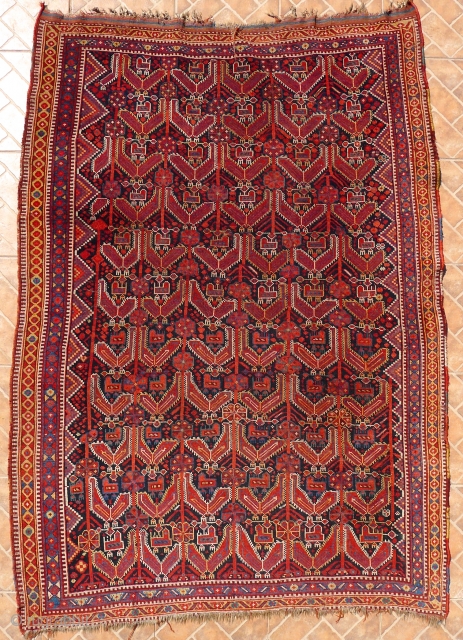 An atypical Khamseh Bird Rug, showing the chicken on top of the hen. In principle, similar to the Khamseh "Mother and Child" Boteh design. General good condition with slight overall wear and  ...