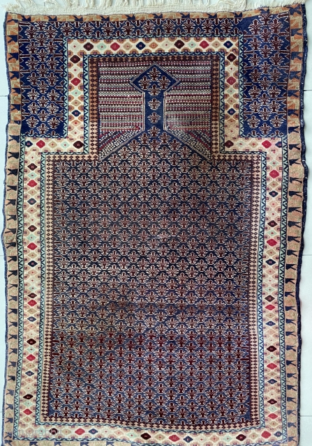 Early dokhtar-e qazi Baluch prayer rug. End piles in top right corner needs a small repair. Other than that in excellent condition. 110x165 cm. Available.        