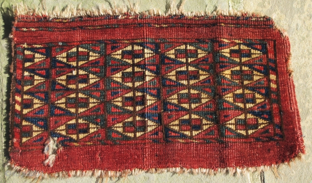  Finely woven Yomud Kap, missing narrow solid red border on one side, small hole(easily repaired),
19th. century, 15'' X 8'' (38 X 23 cms)         