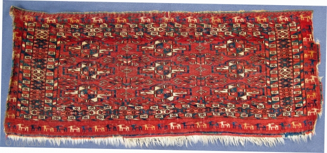 Finely woven Tekke Mafrash with wonderful goat procession border;
beautiful natural color spectrum, highlights in ruby silk;
pile is acceptably evenly low!
early 19th. century, 28" X 11"[71 X 28cm]      