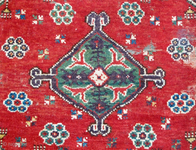 Dazkiri rug, 18th. century, beautiful colors including an intense aubergine, good pile with some damaged areas, alternating warp clusters of red and green, supple handle, 56" X 44"[142 X 111cm]   