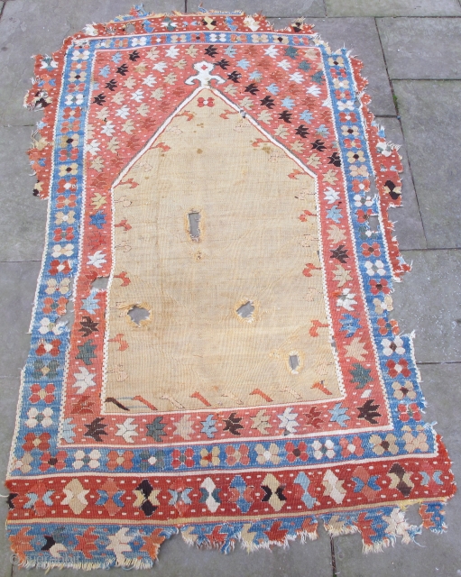 Early Anatolian prayer kelim, 17th. century,replete with lazy lines, the number of borders remaining at the bottom of the piece 
 indicate that   the rest of the rug originally had  ...