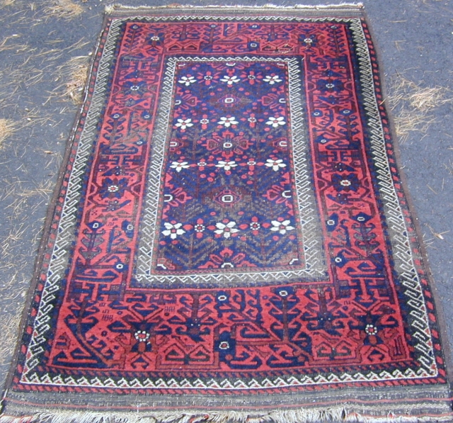 Beluch rug with lovely colors and striking design, scattered corrosion wear, original selvedges, kelim on both
ends, 19th. Century,6'7''X 3'7''.              