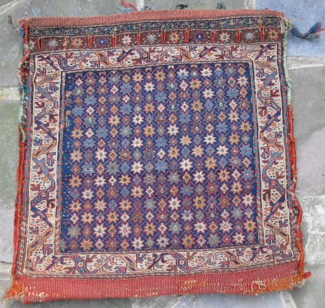 Khamseh Soumak saddle bag with original back, remnants of side wrappings and loop closures,
border design seen in early dragon and floral carpets, mid 19th. century, fine condition,
needful of a good bath, 24"  ...