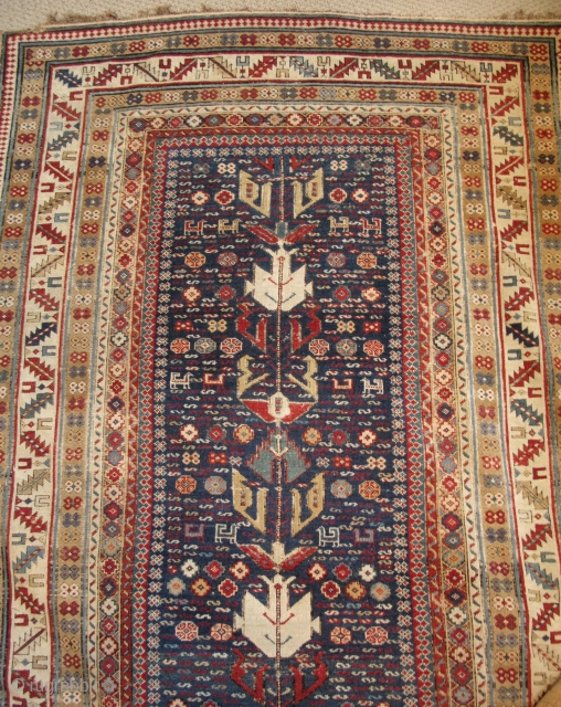 Shirvan runner, missing the bottom borders, cut and shut, a few holes.  Cleaned and stabilized.  All good colours.  A lot of rug for the money, maybe even worth more  ...