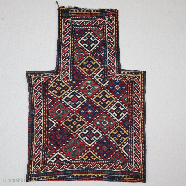 This is a fine Kurd salt bag from the late 19th century, E. Persia, with fantastic all-natural dyes and a wonderful soumak weave. It's a complete piece with an original multicolored back.  ...