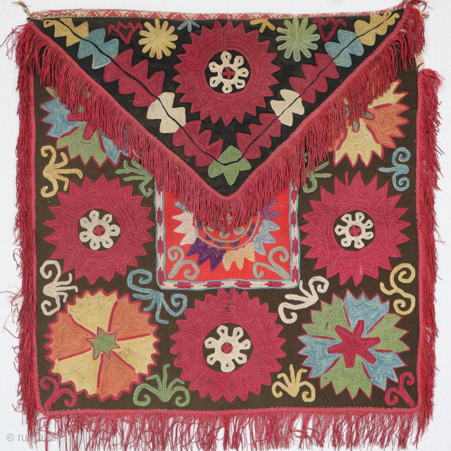 An exceptional rare antique enveloped-shaped needlepoint Embroidered textile made by the famous Lakai tribe of Uzbekistan circa the late 19th Century named Aina Khalita(wedding mirror bag)It has a spectacular color range with  ...