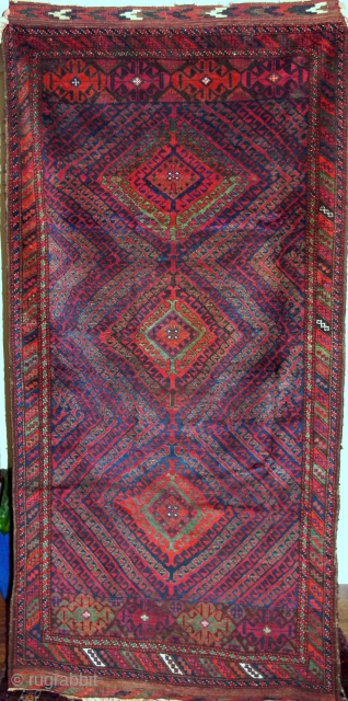 A marvelous antique Baluch rug, from the Sistan region of SE Persia. This one is in excellent condition, with full pile, and original kilim ends. Shimmering colours that come alive in natural  ...