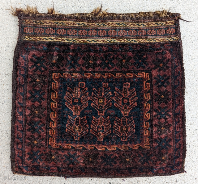 A fine Antique Baluch chanteh late 19th century,wonderful use of blues and reds ,excellent condition with original fine back.size 1'6" × 1'7"           