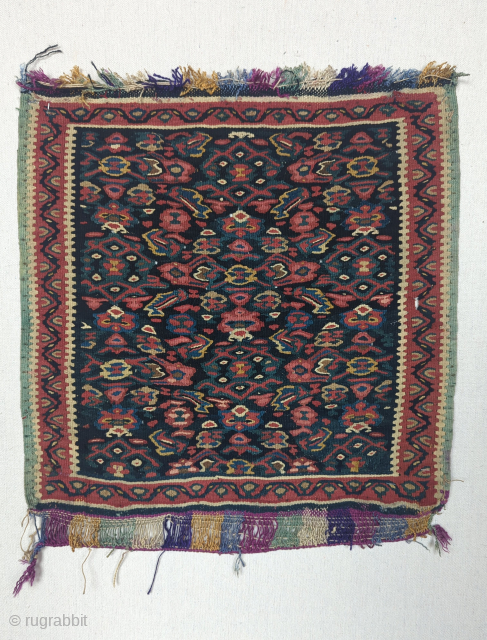 A finely woven  Antique Senneh Kurd small kilim, maybe a Vegirah( sampler), with multi colored silk warp. 
It's made with  gorgeous array of all natural dyes, with the outer edge  ...