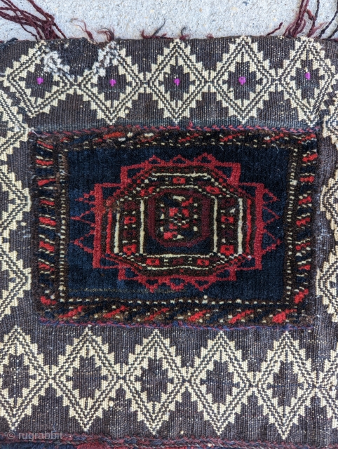 A charming and fine  Antique Baluch Chanteh(personal bag)with pink silk highlights, woven circa 1930 or before in W.Afghanistan or E. Persia. A unique textile with carpet and kilim mix, excellent condition,  ...