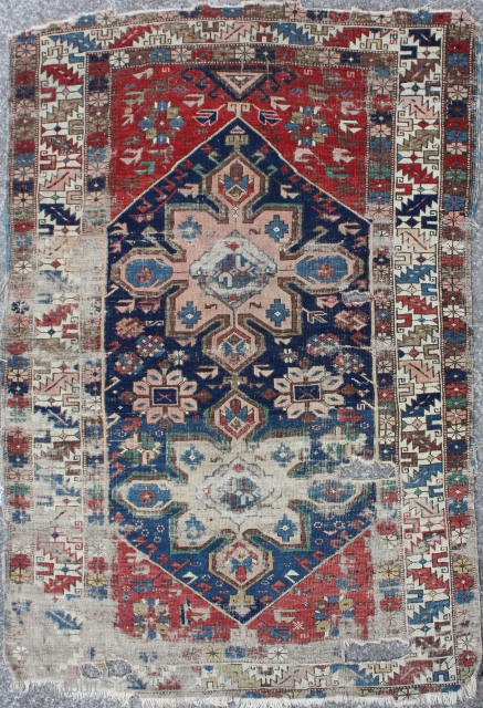 Antique Caucasian Rug,
Size cm:163 x 110,
Size ft:5'5 x 3'8,
Code No:R3229,
Availability:In Stock,
This rug is over 100 years old and some major  damage           