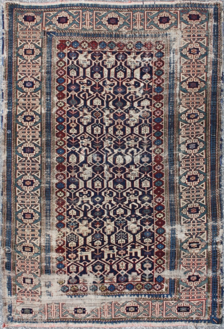 Kuba Rug
Age:Antique
Origin: Caucasian 	
City/Village: 	Kuba
Size cm: 	150 x 105
Size ft: 	5'0 x 3'6
Code No: 	R2881
Availability: 	In Stock/
This rug is over hundred years old and some major damage      