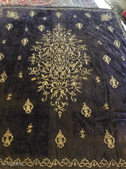 Late 19th C. Velvet Embroidery

Wall hanging of purple silk velvet with large floral bouquet worked in gold metallic thread. Small floral bouquets and single flower worked in gold metallic thread interspersed in  ...